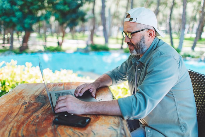 Campground-owner-laptop-outside-small